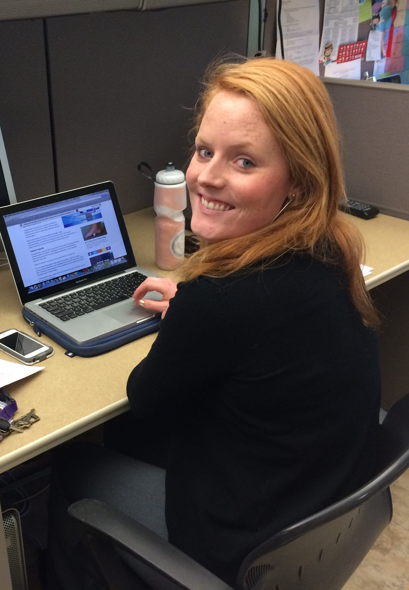 Clare McCarthy at work in the IowaWatch offices during her summer 2015 internship. McCarthy is also involved in IowaWatch's spring college media project.