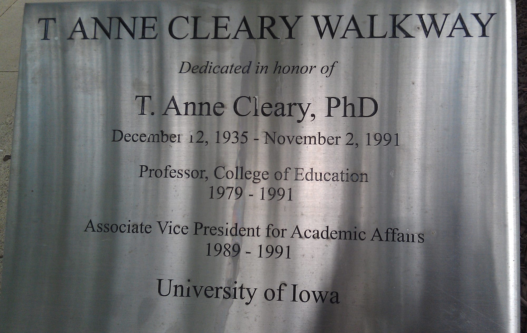 A sign marks the University of Iowa's T. Anne Cleary Walkway.