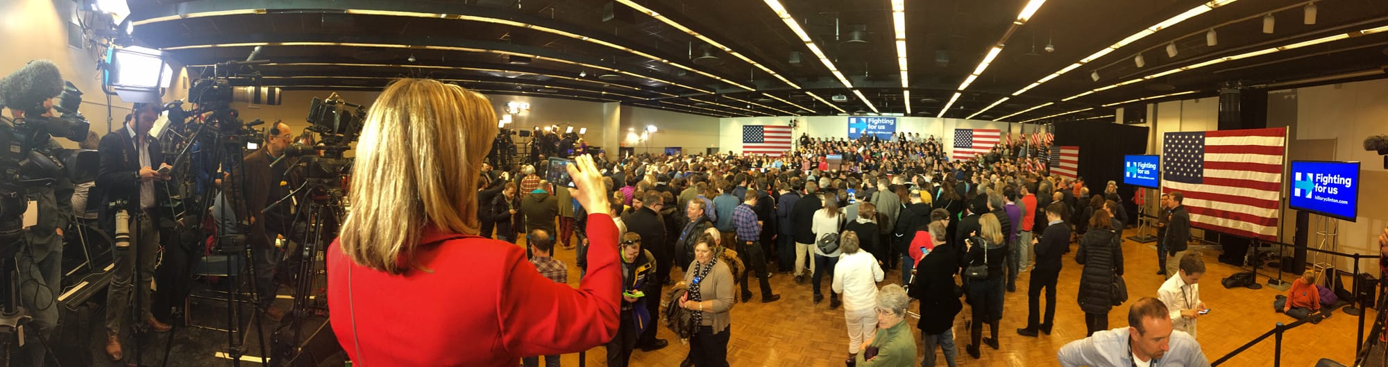 Supporters gather at the Hillary Clinton campaign celebration in Des Moines Monday night, Feb. 1, 2016, after the Democratic presidential precinct caucuses earlier in the night.