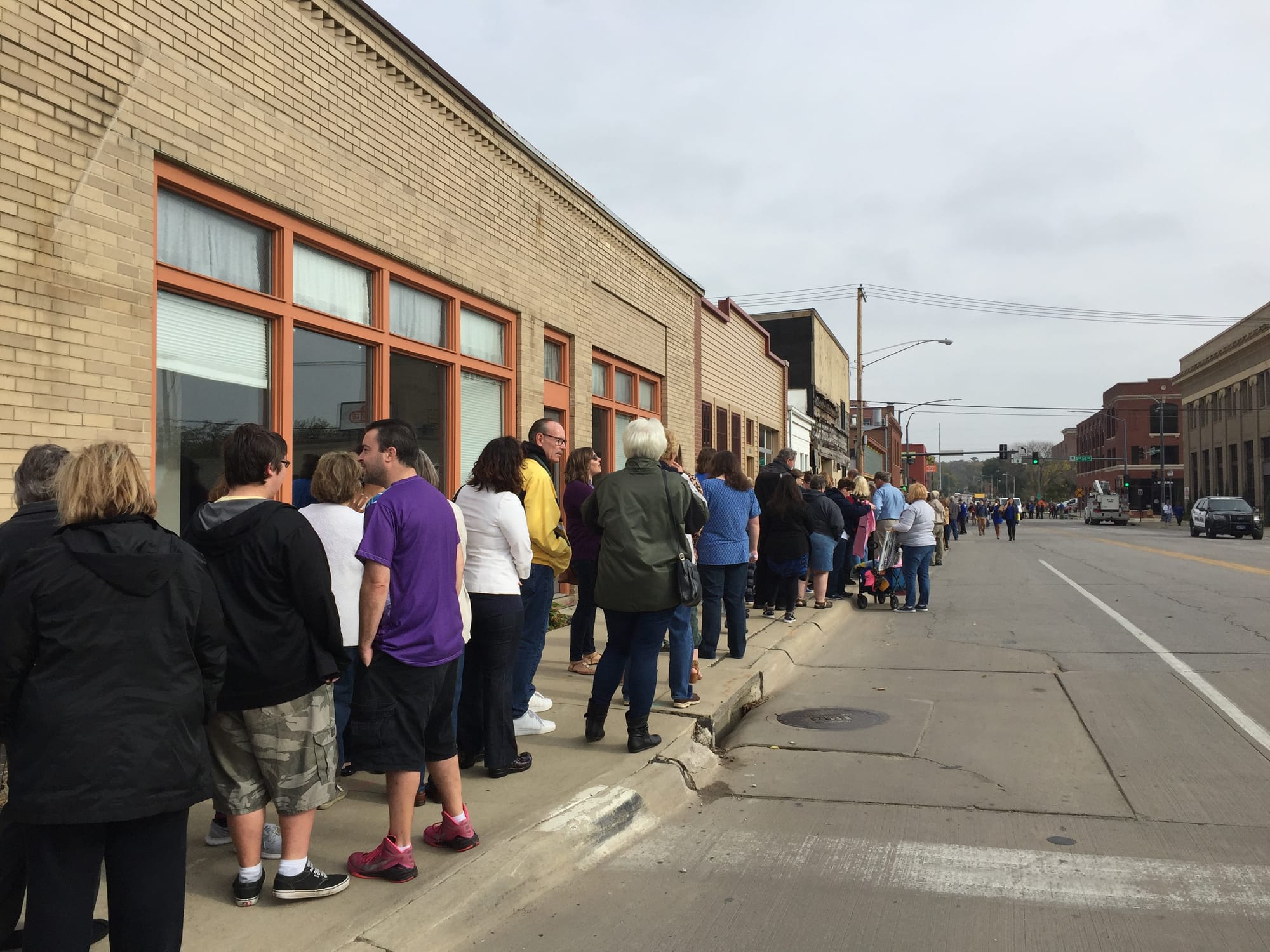 Supporters lined up in the Cedar Rapids New Bo Business District to see Democratic presidential candidate Hillary Clinton on Friday, Oct. 28, 2016,