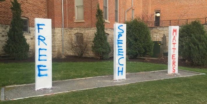 "Free speech matters" reads the writing on three posts at Cornell College in mid-April 2016. This was a response to an initial painting on April 11 that read, “Build a Wall. Build it Tall.” That initial painting was replaced with “Wall or No Wall We Stand Tall. Land of Immigrants." 