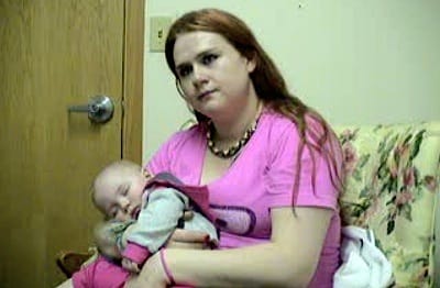 Melissa Harris holds her daughter, Reagan, during an interview at the Heart of Iowa treatment center in Cedar Rapids on March 15.