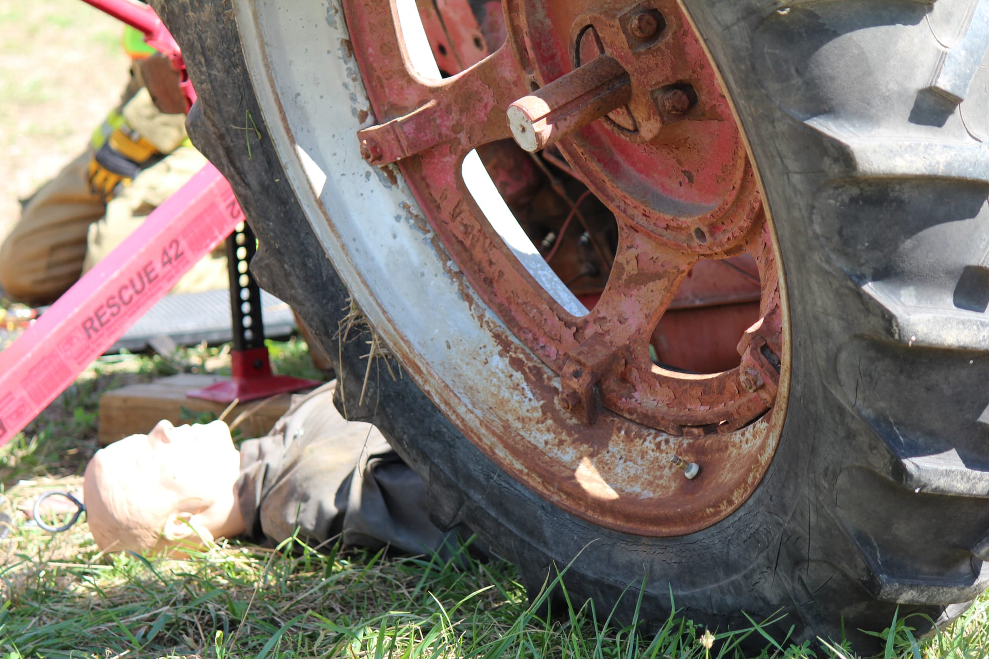 A dummy placed beneath a rolled over tractor gives Eastern Iowa firefighters a chance to practice their response in situations involving a farmer. This photo is from Tractor Roll Over Extrication Training put on by the Rural Health and Safety Clinic of Greater Johnson County on Aug. 3 at the Johnson County Extension Building in Iowa City.