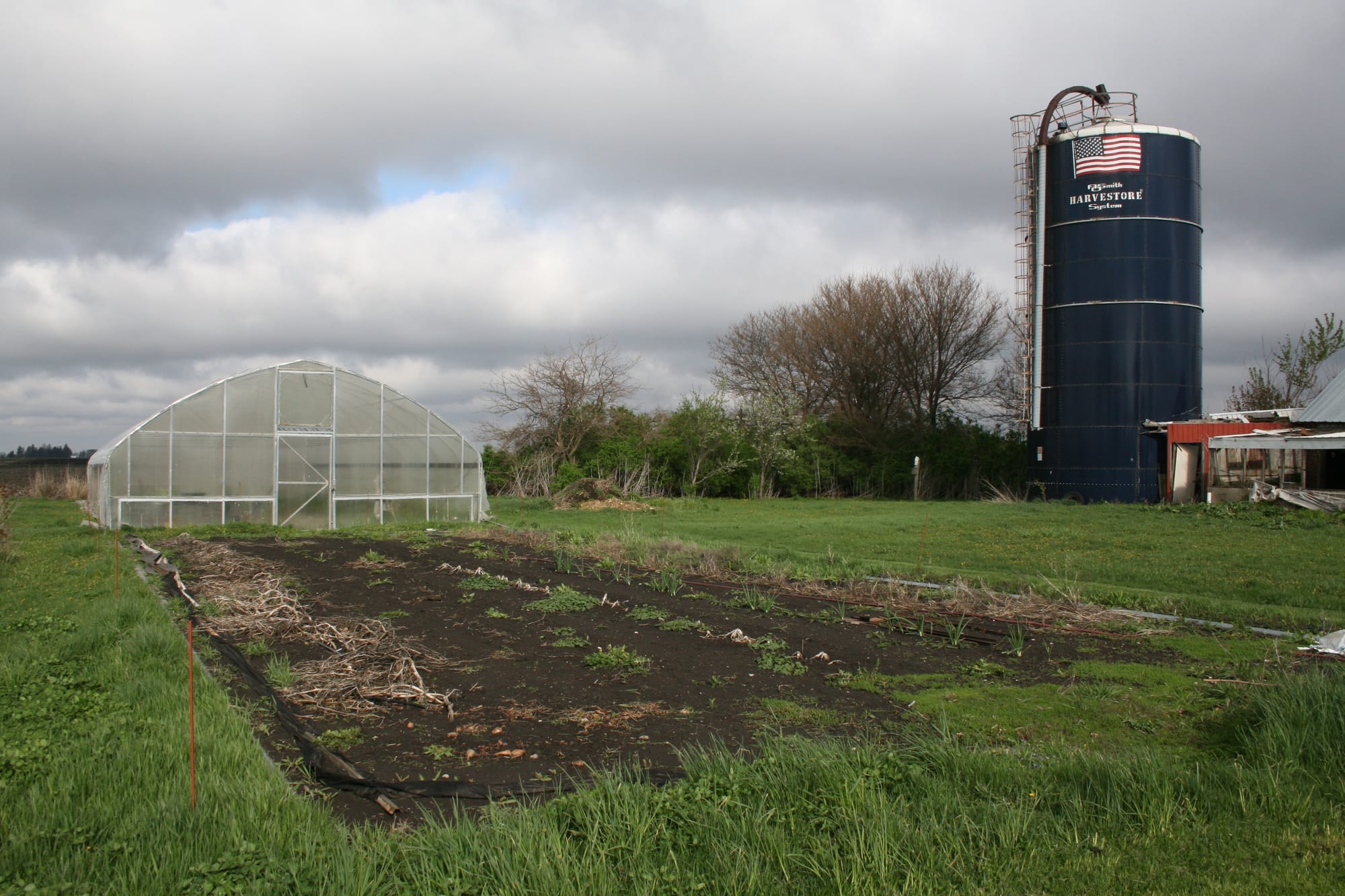 Using a high tunnel allows Rob Faux to extend his growing season, but it was also in the path of the spray in 2012 when an airplane accidentally dumped pesticides on his organic crops. The crops had to be destroyed and the fields and the produce in them couldn’t be re-certified as organic for three years, in 2015. This photo was taken April 29, 2016. 