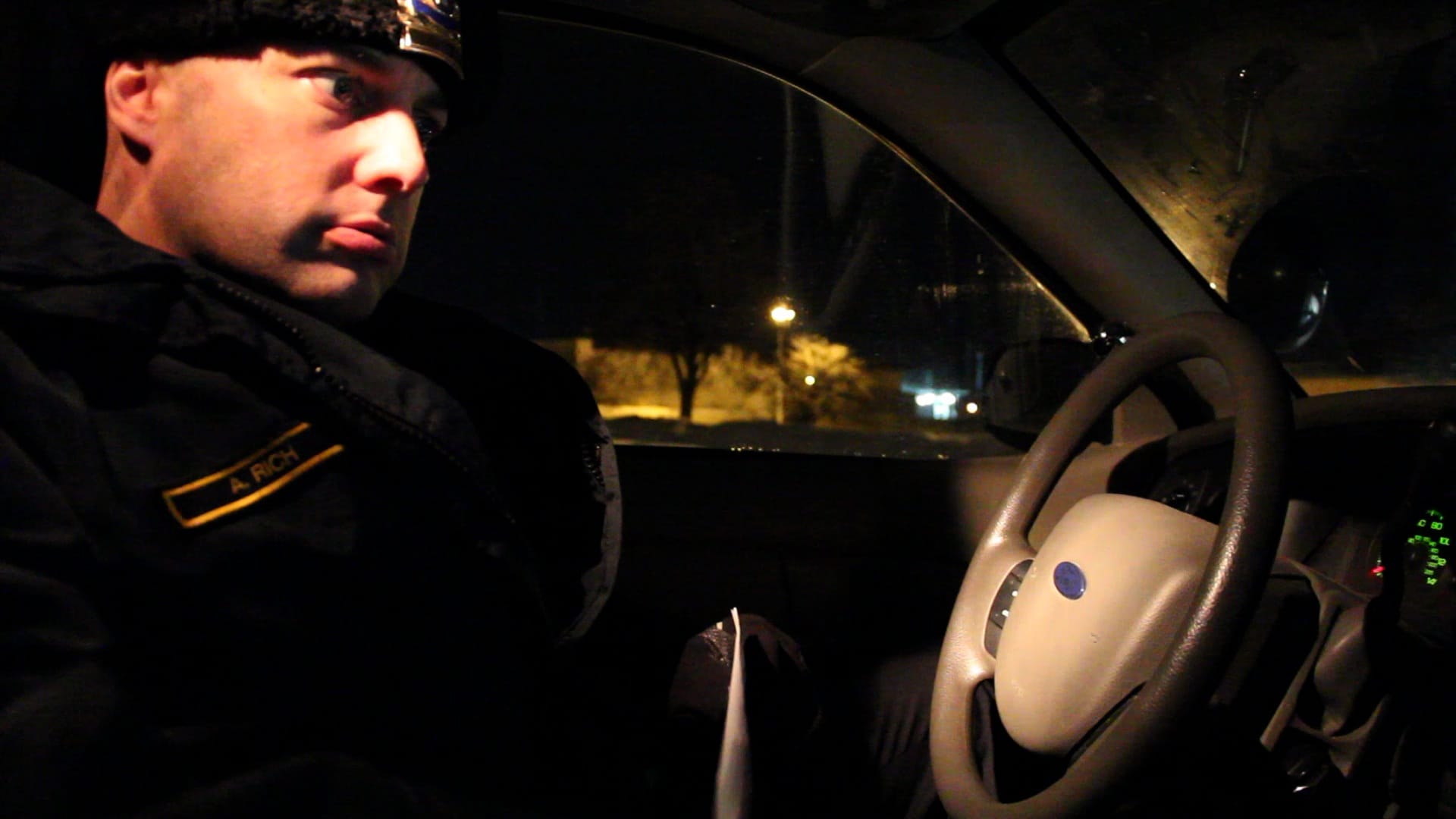 Iowa City Police Officer Derek Frank in his squad car in early March 2014.