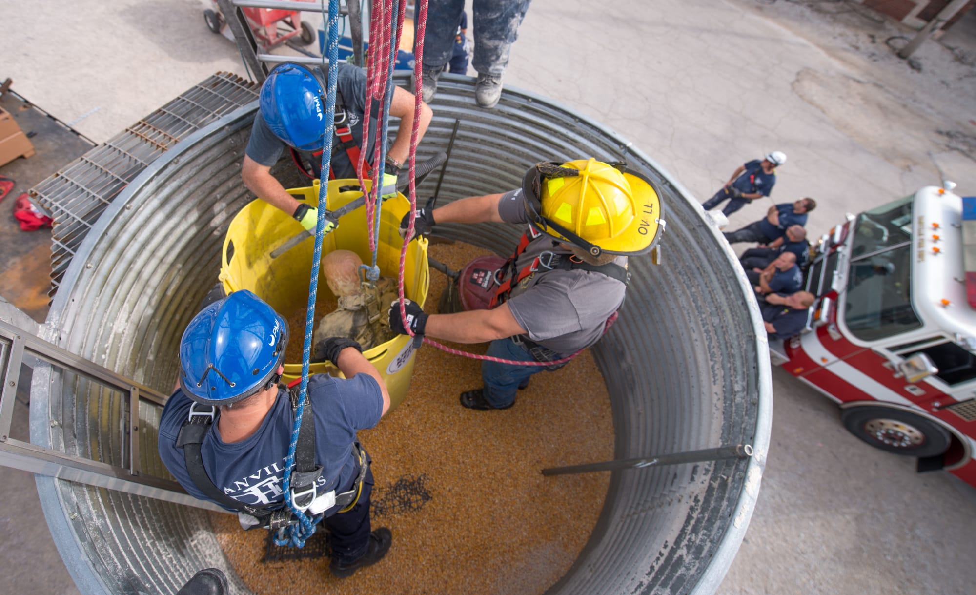 Firefighters practice placing a rescue tube during grain bin rescue training at the Danville, Ill., Bunge facility on Sept. 17.
