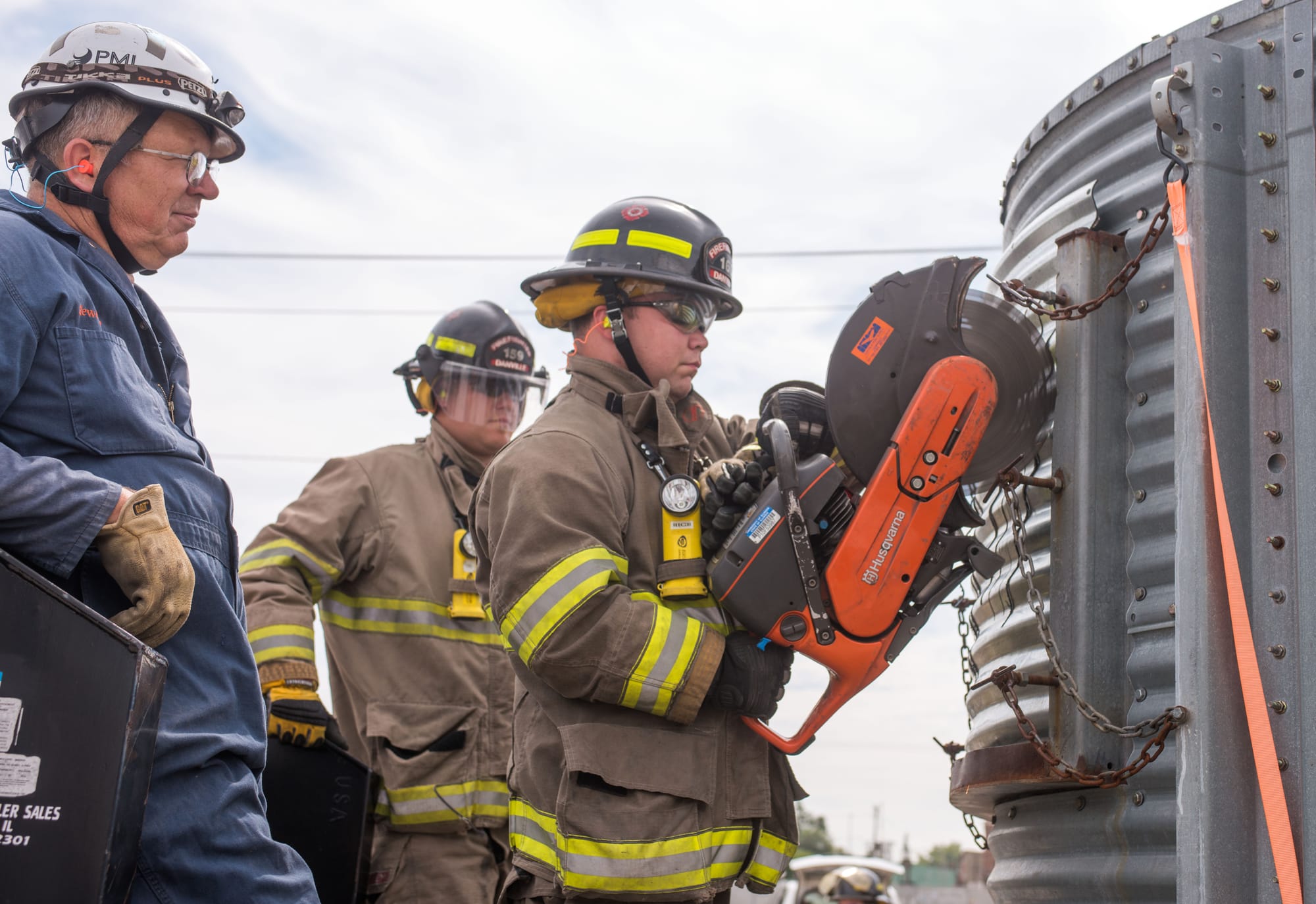 Firefighters learn how to cut grain relief slots during grain bin rescue training at the Danville, Ill., Bunge facility on Sept. 17.