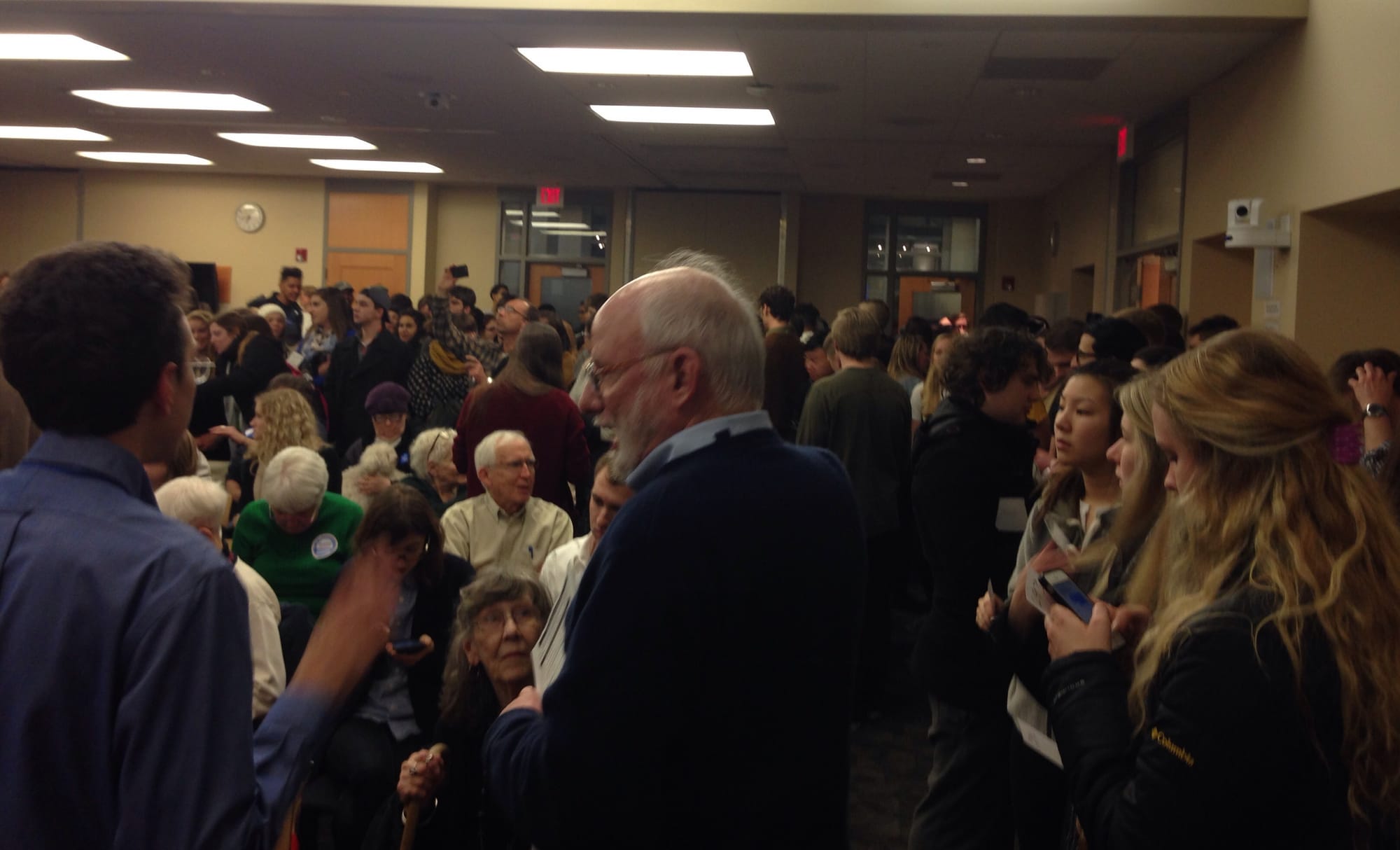 Democrats pack an Iowa City Public Library meeting room for the start of Tuesday night's Iowa presidential precinct caucuses.