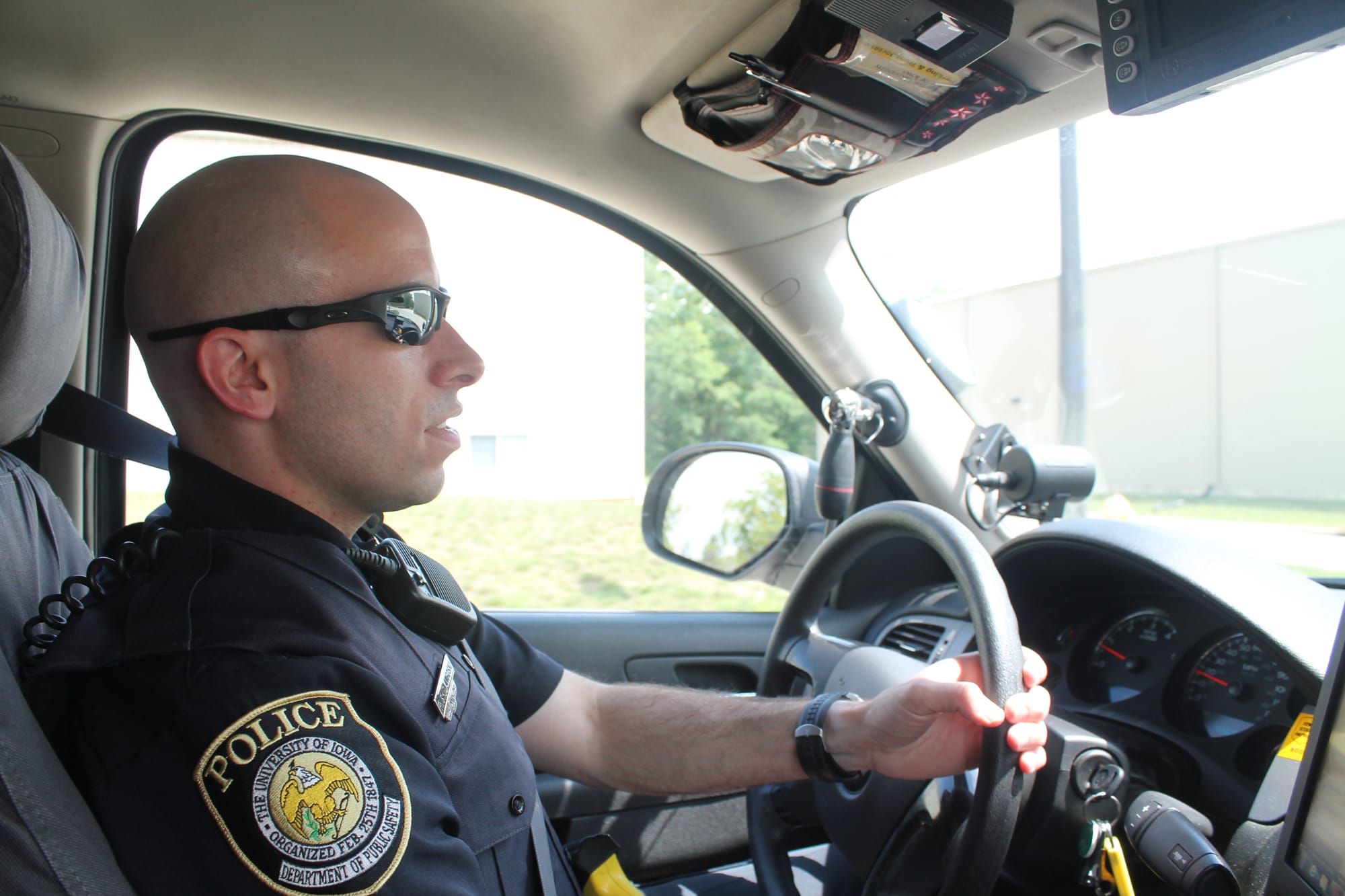 University of Iowa Police Officer Russell Shelangoski on patrol near the UI Research Park in July 2013.