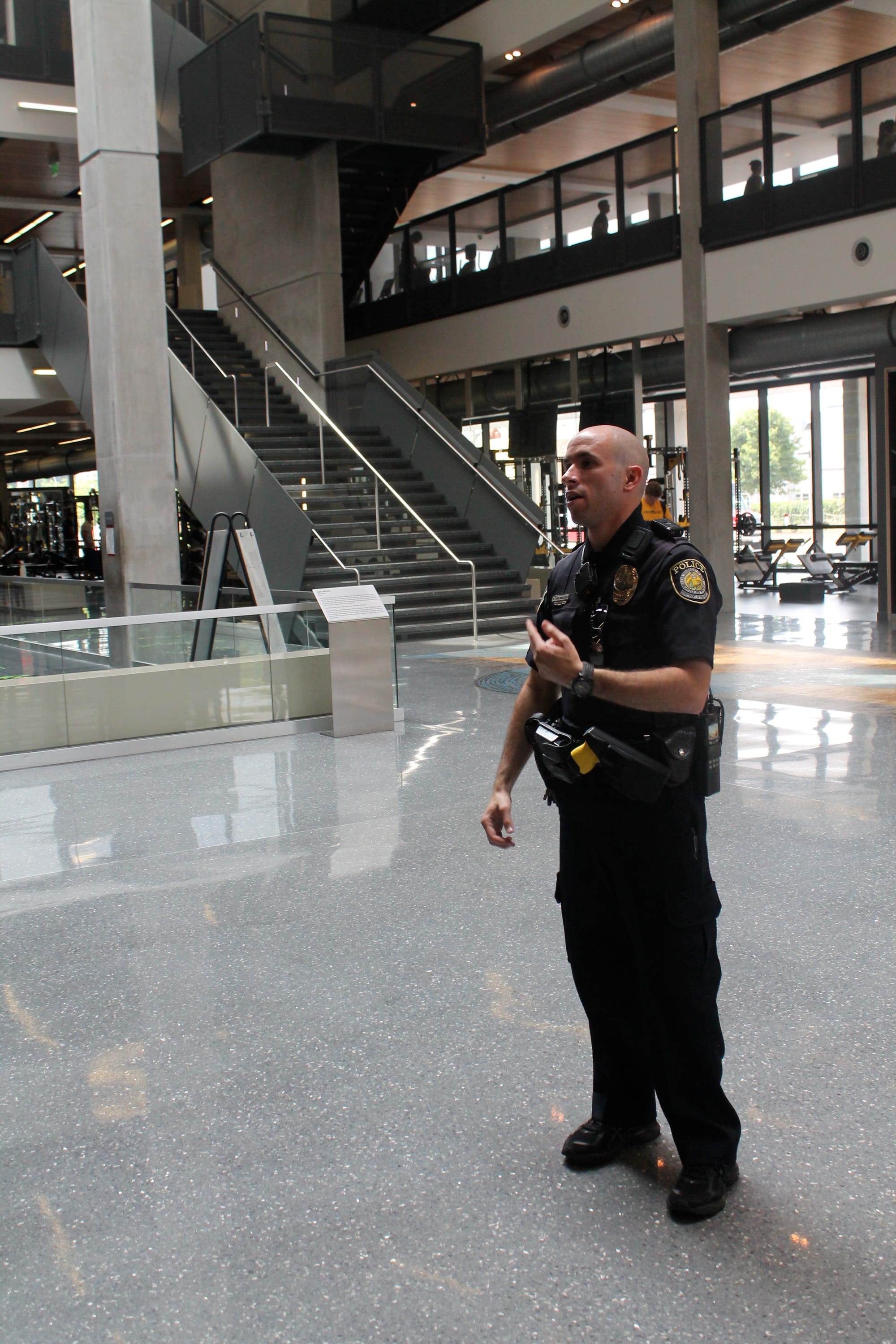 University of Iowa Police Officer Russell Shelangoski does a walk through of the Campus Recreation and Wellness Center in July 2013.