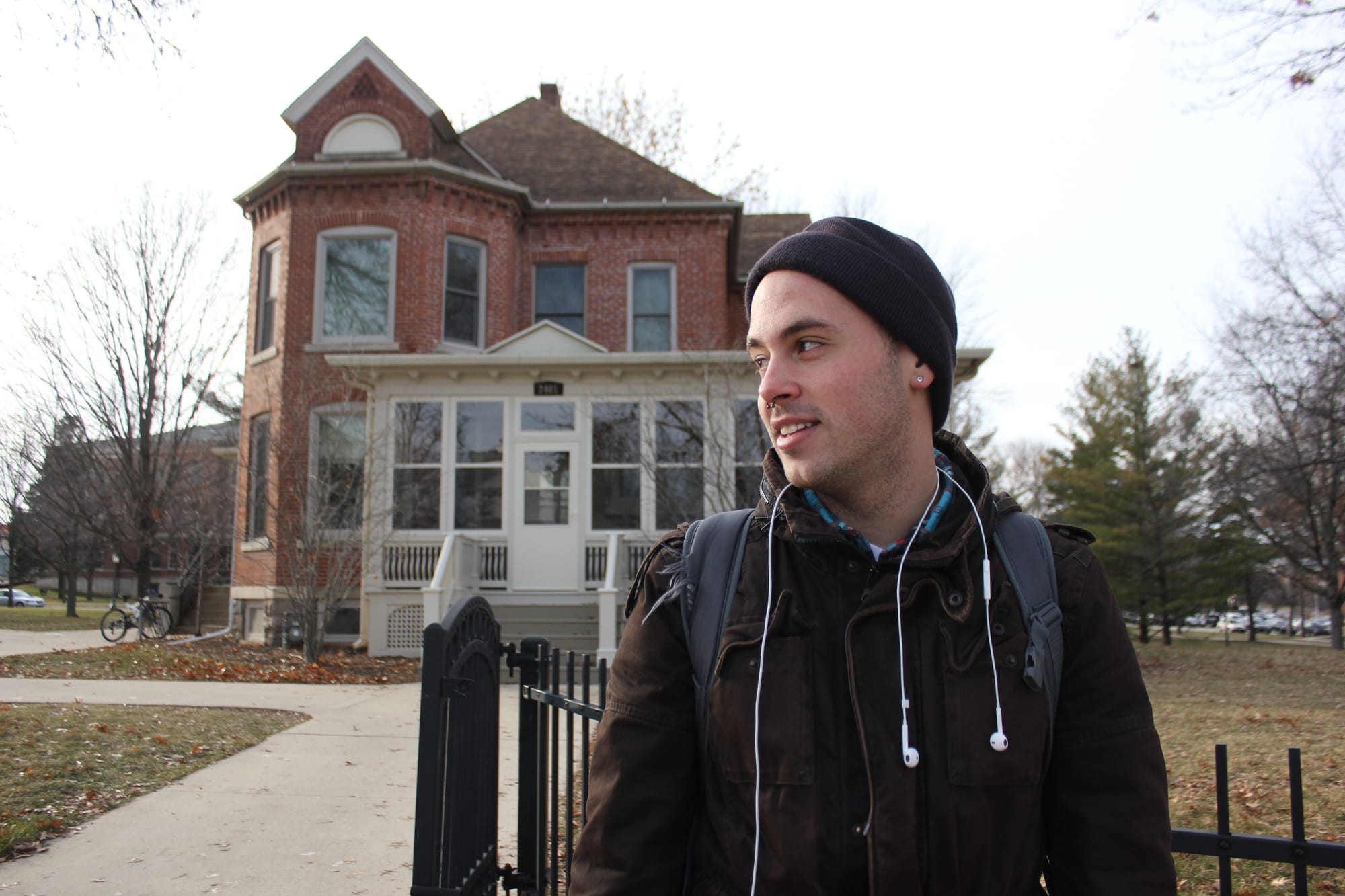 Art major Jordon Deutmeyer stands outside of the University of Northern Iowa Honors Cottage in December 2013.