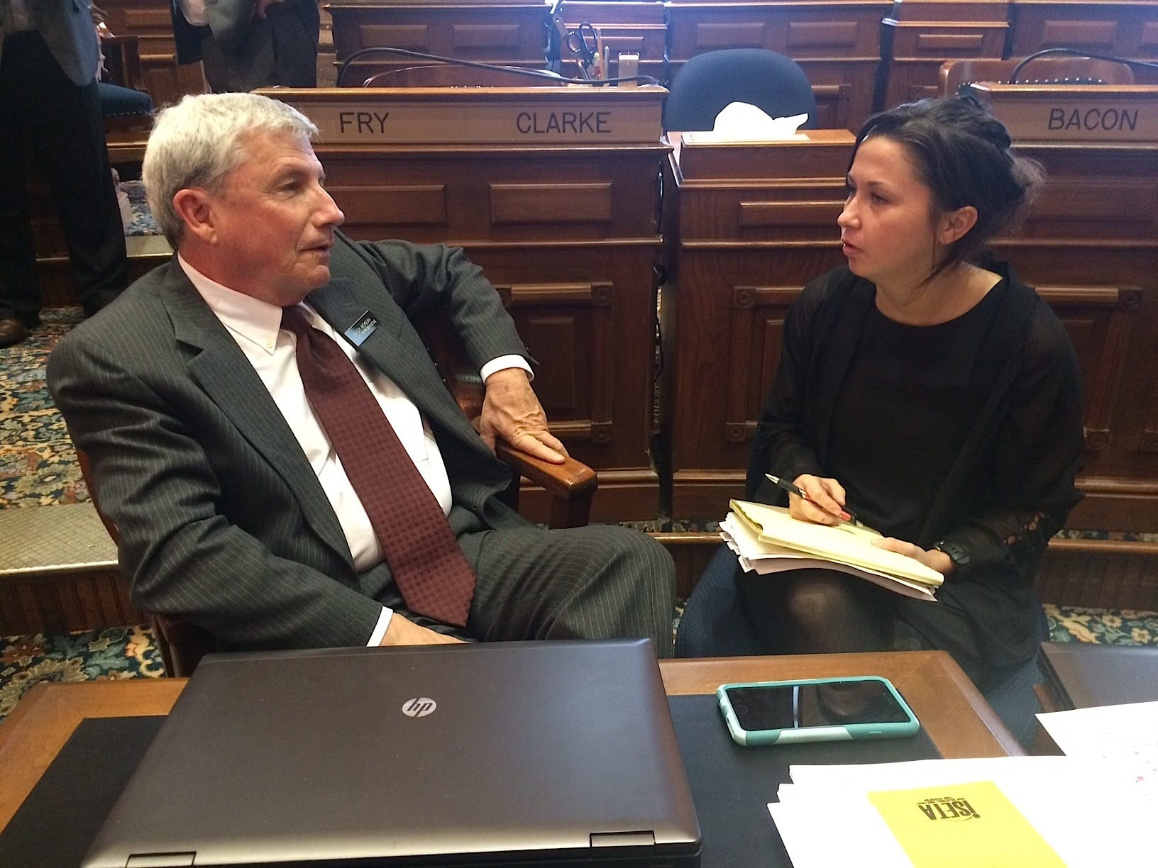 IowaWatch intern Krista Johnson, a University of Iowa senior journalism student, interviews Iowa state Rep. Andy McKean, R-Anamosa, on Jan. 10, 2017, on the Iowa House floor.