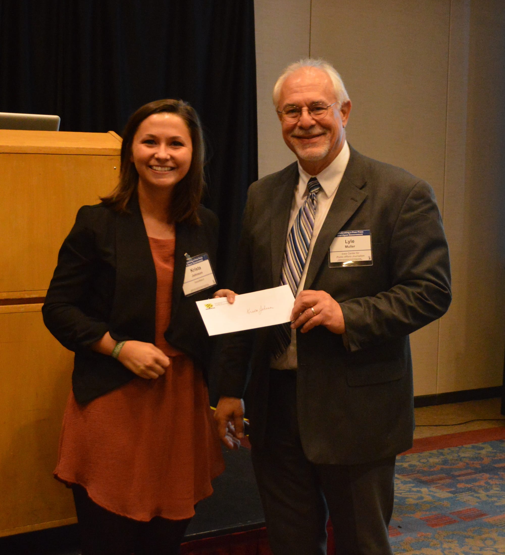 University of Iowa senior Krista Johnson receives the IowaWatch/Fotini Perlmutter Award the night of Sept. 29, 2016.