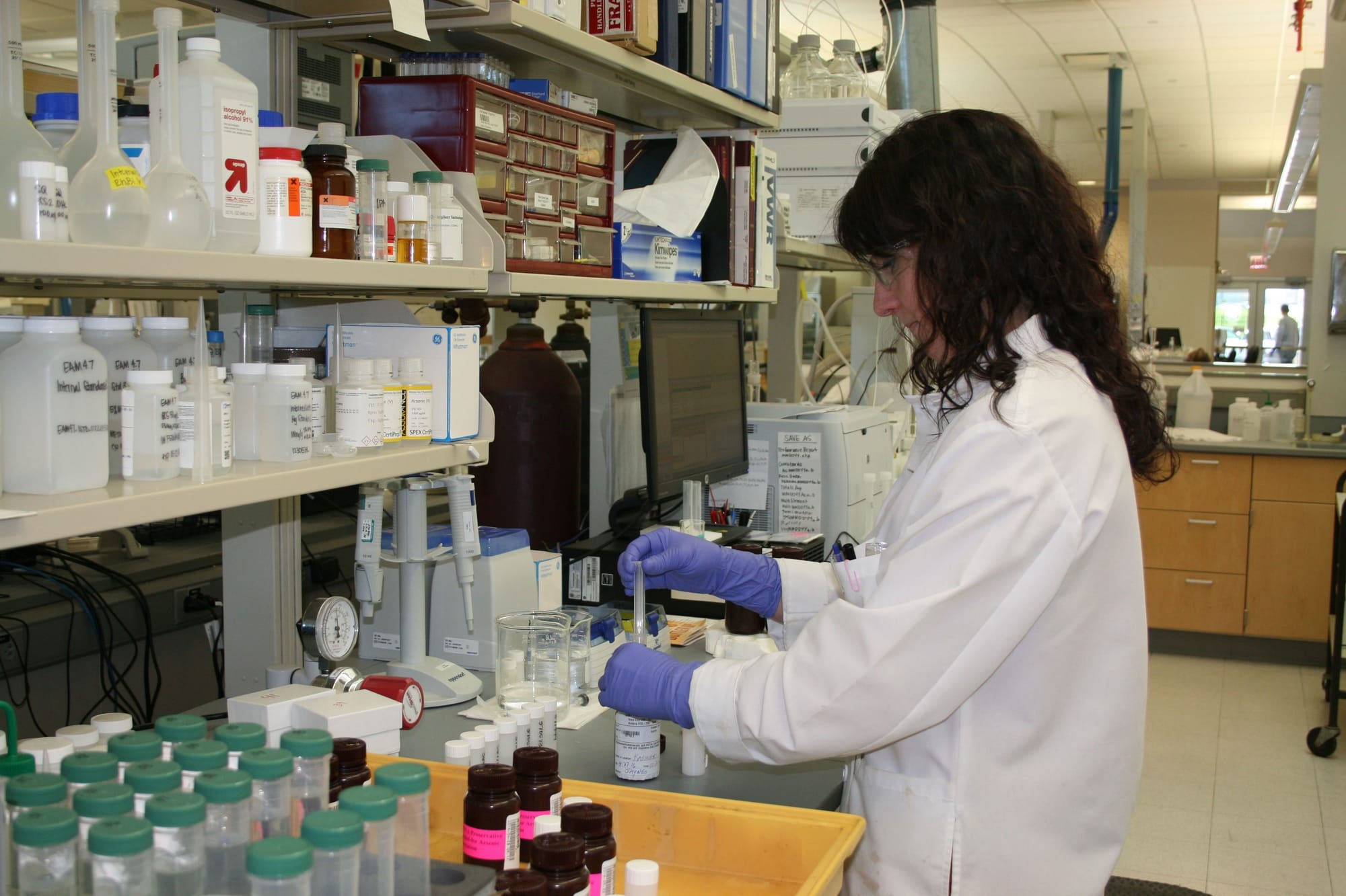 Hannah Lyons, an environmental lab analyst with the Iowa State Hygienic Lab, filtered samples prior to an arsenic speciation test, which can determine the concentration of each type of arsenic — arsenic V and arsenic III, which is more difficult to remove from water. Picture taken May 3. 