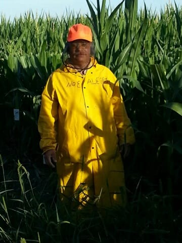 Migrant worker Noé Alegria, in a Nebraska farm field in summer 2013. Alegria is one of 13 migrant workers who sued Monsanto in U.S. District Court in Texas for failing to pay wages due while working in Iowa. Monsanto settled the case.