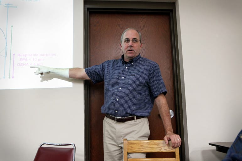 Patrick O'Shaughnessy, a professor of occupational and environmental health in the University of Iowa College of Engineering, speaks at a public meeting of the Mine Reserve Expansion Study Committee. O'Shaughnessy says although the risk to nearby residents from silica is small, a mine's overall record should also be considered.