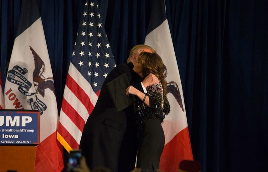 Republican presidential candidate Donald Trump and former vice presidential candidate and Alaska Gov. Sarah Palin hug before Palin delivers her endorsement of Trump in Ames on Jan. 19, 2016.