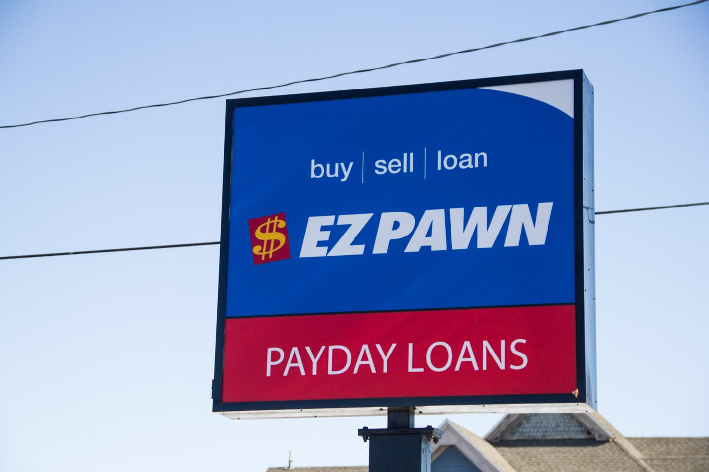 The sign for Easy Cash Solutions and the neighboring store, EZ Pawn, on First Avenue in Cedar Rapids is pictured on February 26.