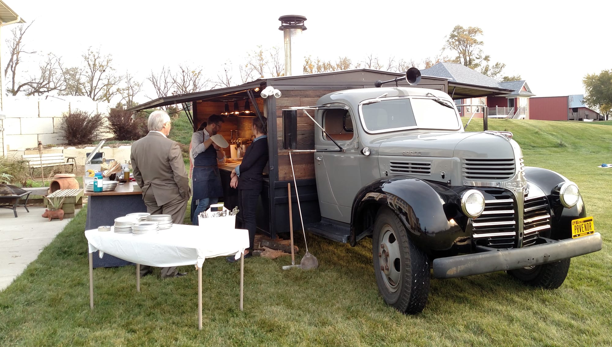 Provender sets up its wood-fired oven in preparation for the 2015 IowaWatch Fun-raiser and silent auction.