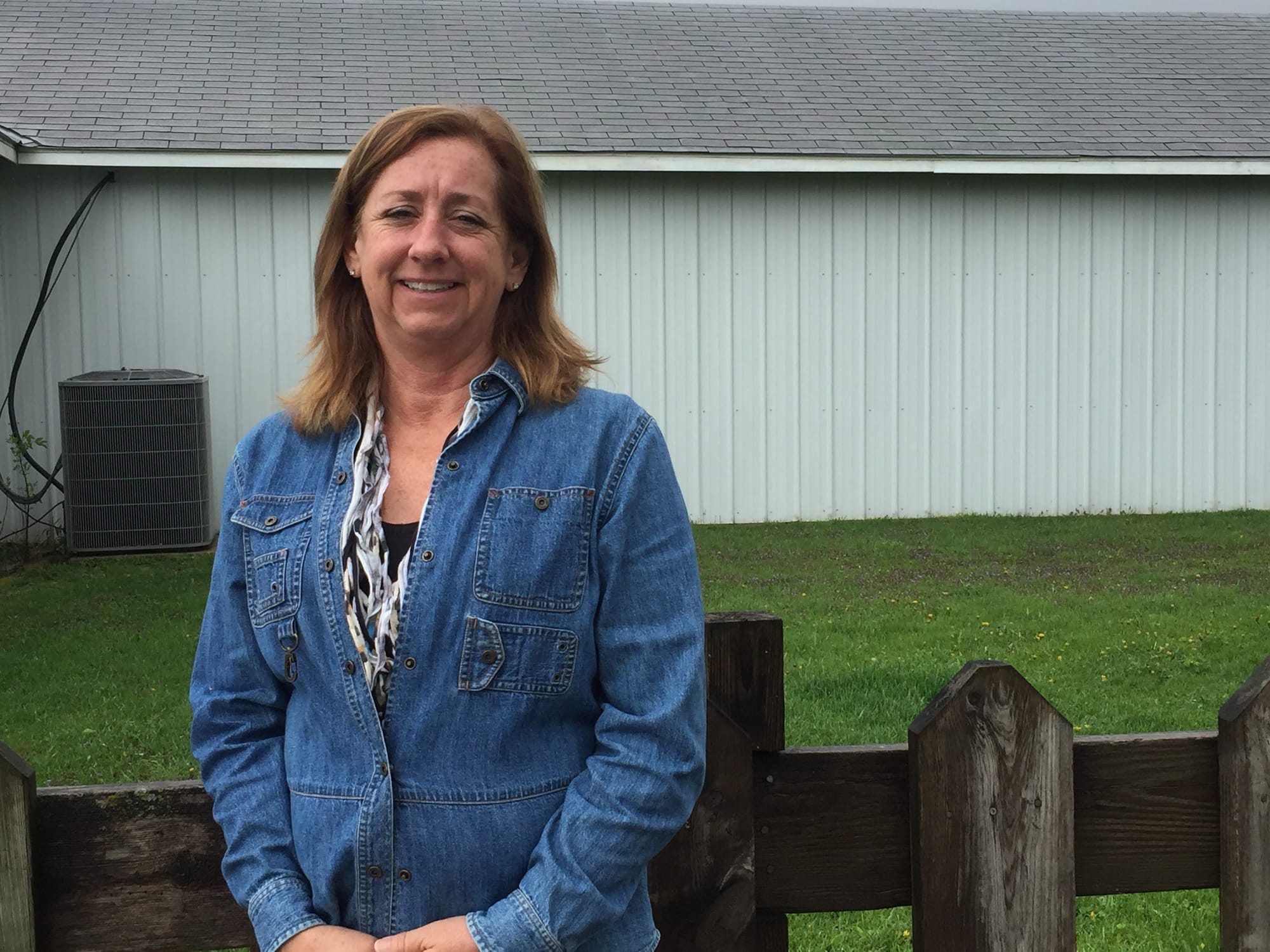 Karla Sibert, of Palo, Iowa, intercepted scammers who had targeted her mother for $44,000 in credit card charges over a 20-month period. Sibert is shown here in early May 2016 at Hawkeye Downs in Cedar Rapids, where she is business manager.