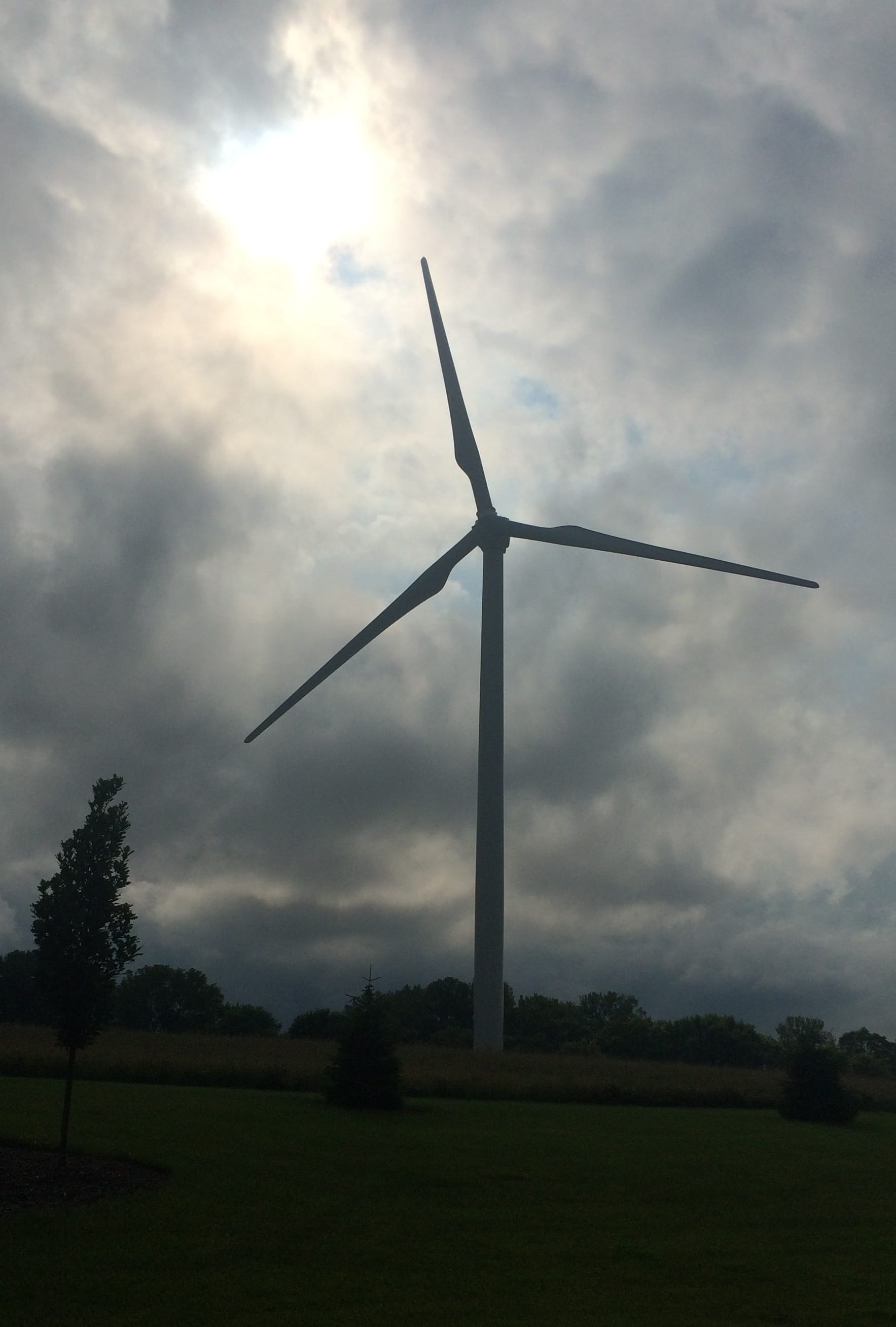 A lone wind turbine stands at Kirkwood Community College in Cedar Rapids. Students in Kirkwood’s Energy Production and Distribution Technologies program use the 417-foot tall, $5.2 million turbine as a learning laboratory. Photo taken June 28, 2015.