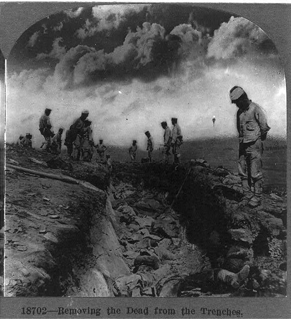 Removing the dead from the trenches in World War I.