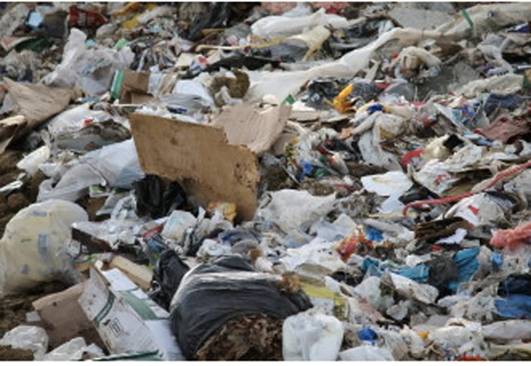 It’s not hard to see wood, papers, cardboard and some other recyclables mixed in the garbage at the Iowa City Landfill