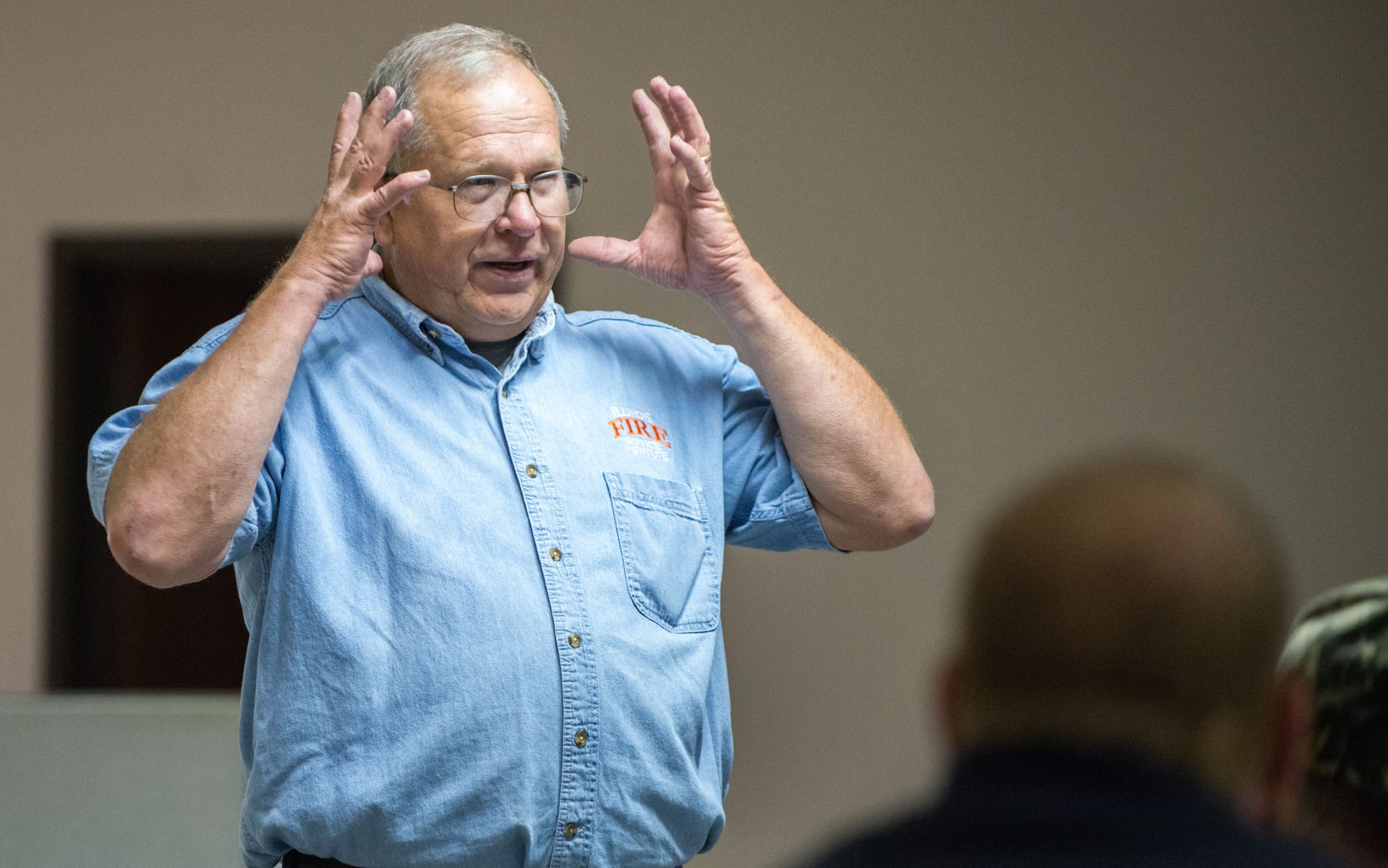 Firefighters listen to Fire Service Institute instructor  Dave Newcomb during grain-bin rescue training at the Danville Bunge facility on Tuesday, Sept. 17, 2013.