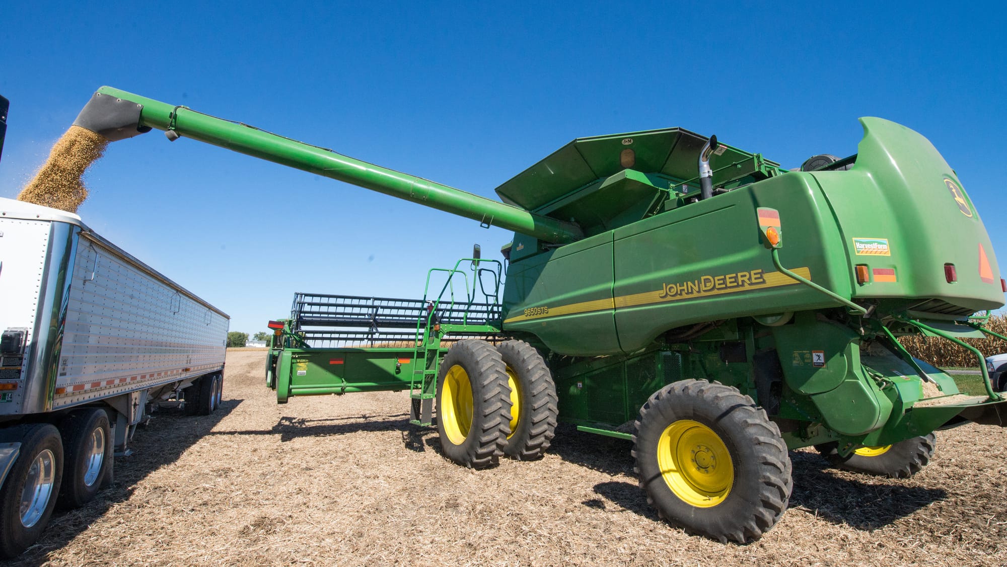 Soybeans are offloaded from a combine to a waiting truck on Oct. 9, 2013. Brian Diers, a soybean researcher, said genetically engineered soybeans have helped protect yields.