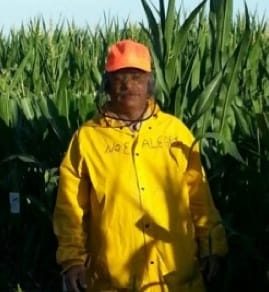 Migrant worker Noé Alegria, in a Nebraska farm field in summer 2013. Alegria is one of 13 migrant workers who sued Monsanto in U.S. District Court in Texas for failing to pay wages due while working in Iowa. Monsanto settled the case.