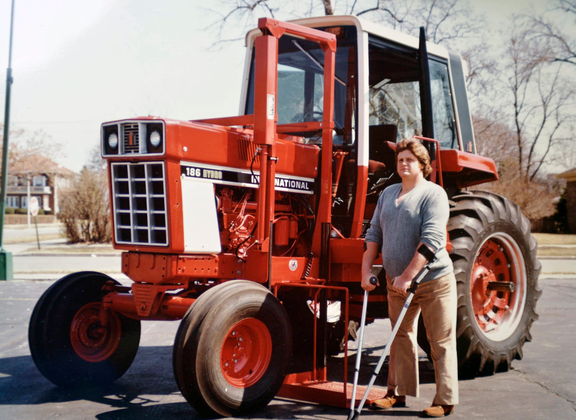 Chip Petrea stands near a modified tractor after his accident.