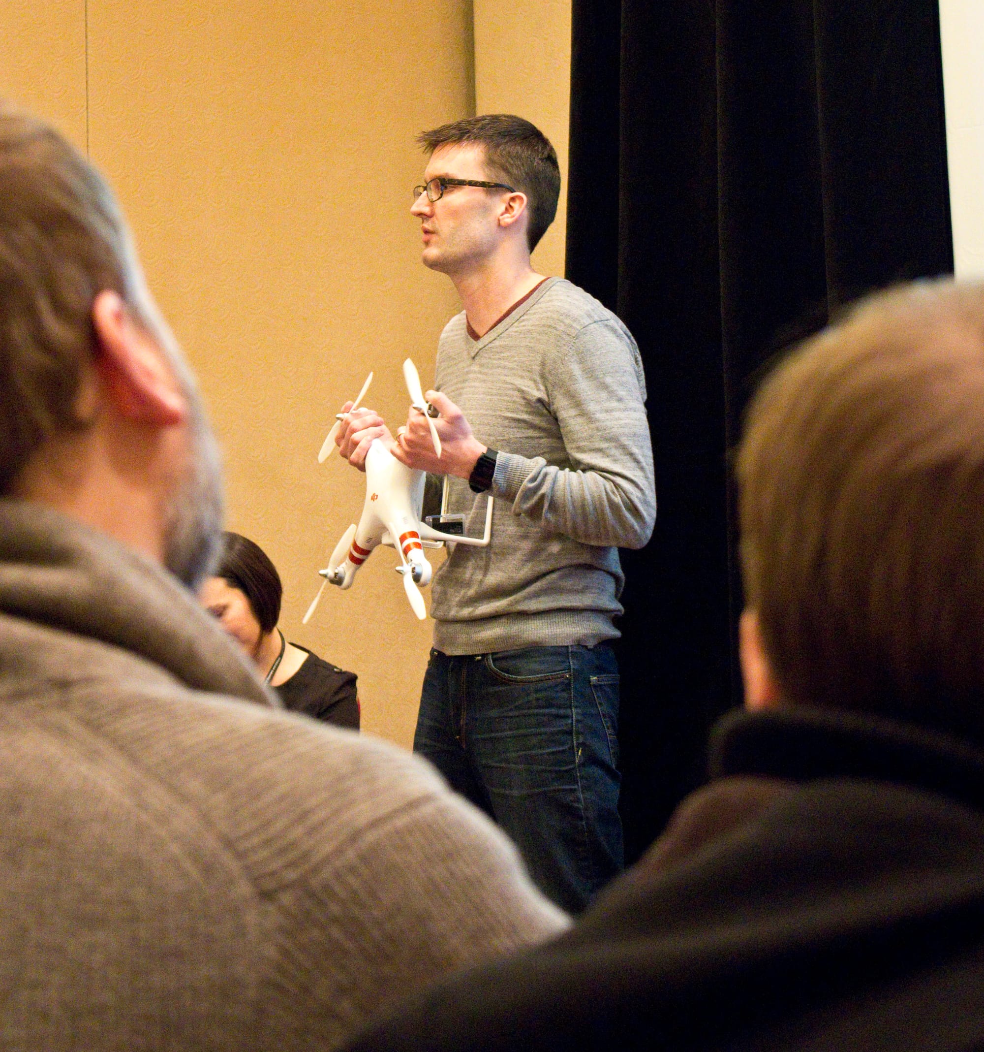 Matt Waite holds a drone while giving a presentation on citizen journalism in Baltimore. Waite is a professor of journalism at the University of Nebraska who teaches a class on the use of drones in journalism.