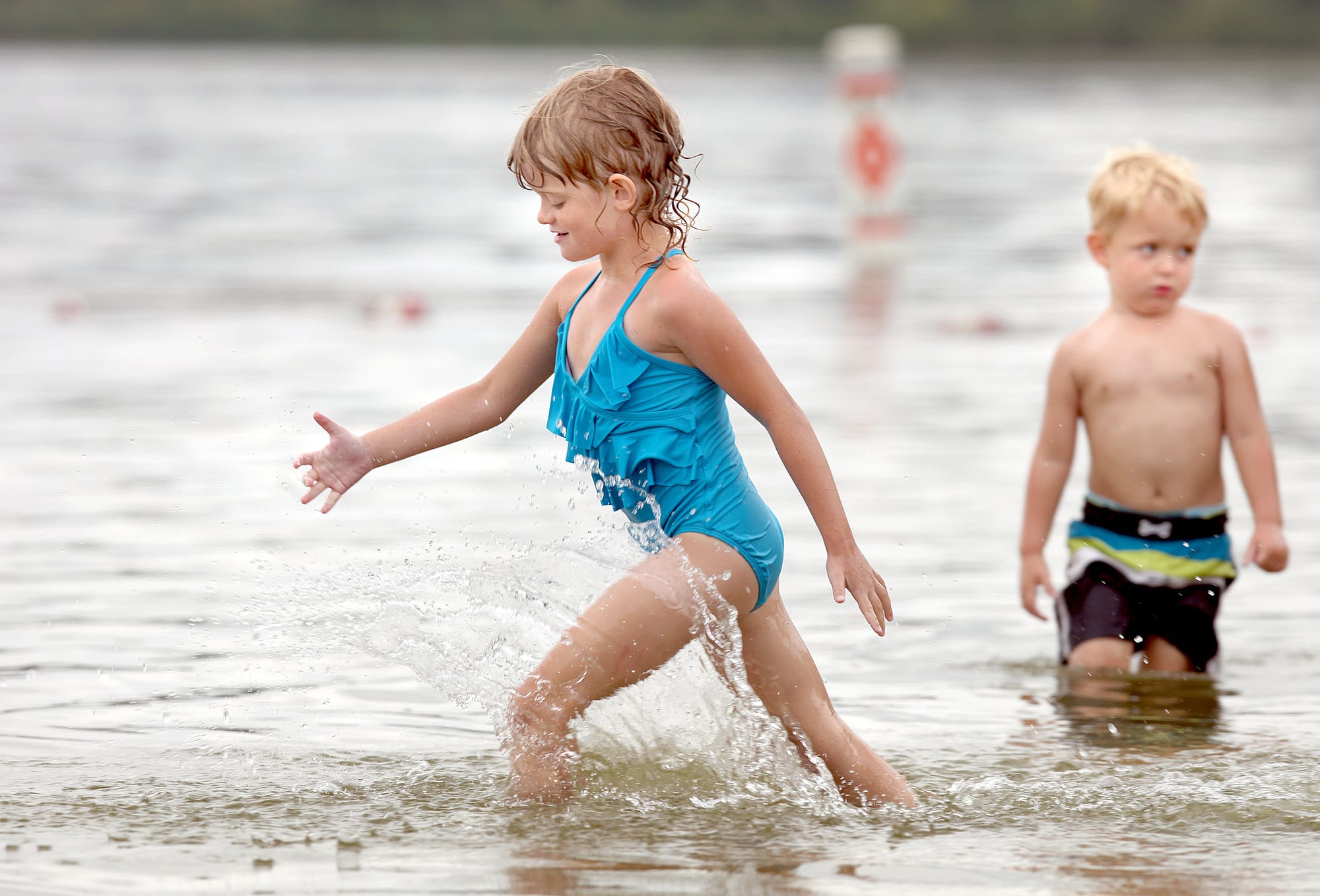 Tarah Delonay, 6, and her brother Ryan Delonay, 3, play at Madison’s Vilas Park beach on Sept. 1, 2013. At Vilas, where geese have contaminated the water, beach closures dropped significantly in 2013.