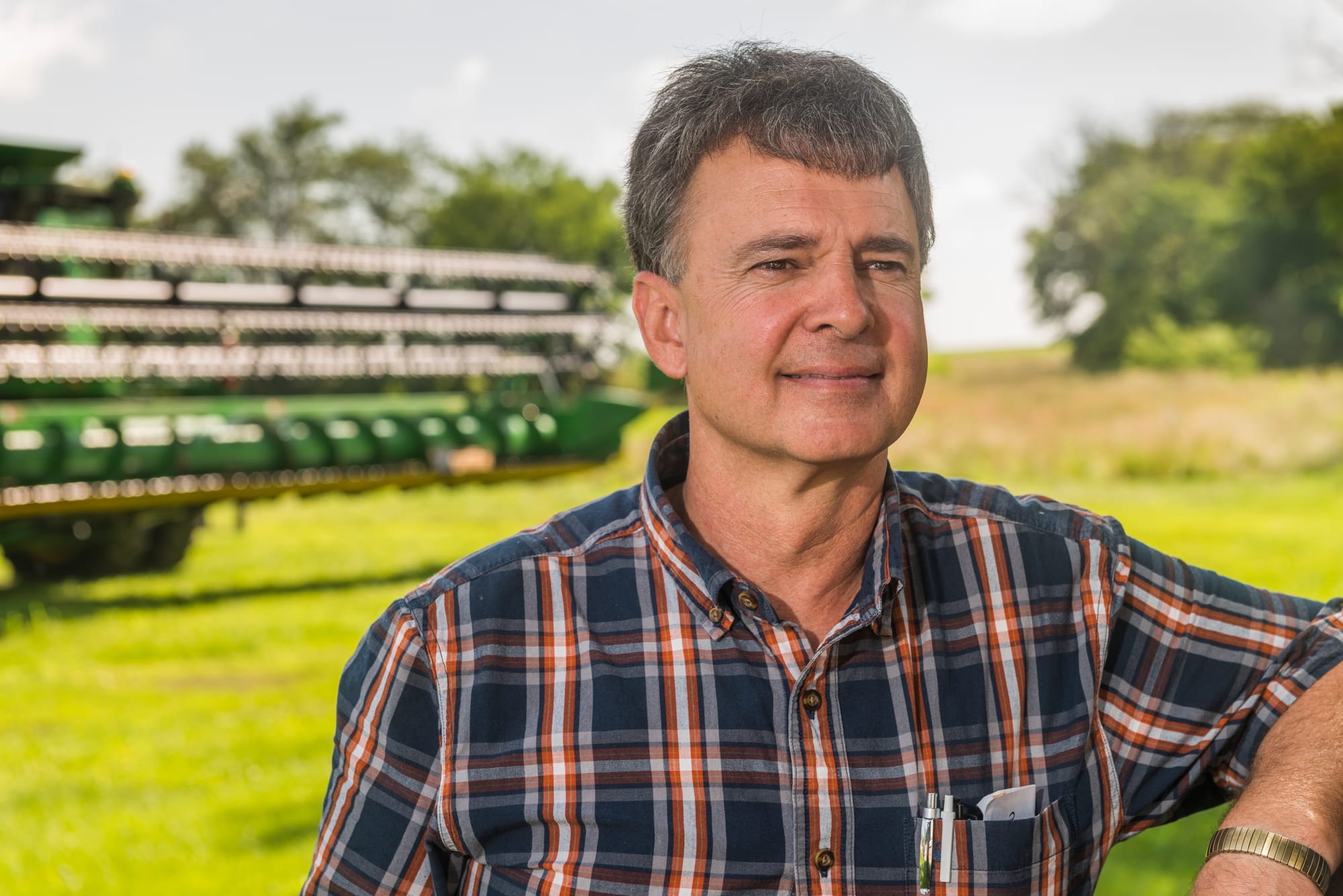 Mark Crawford stands at his farm near Danville, Ill. Crawford, who grows corn, soybeans and wheat on his large farm, said the crop insurance programs are important parts of the risk-management safety net for farmers.