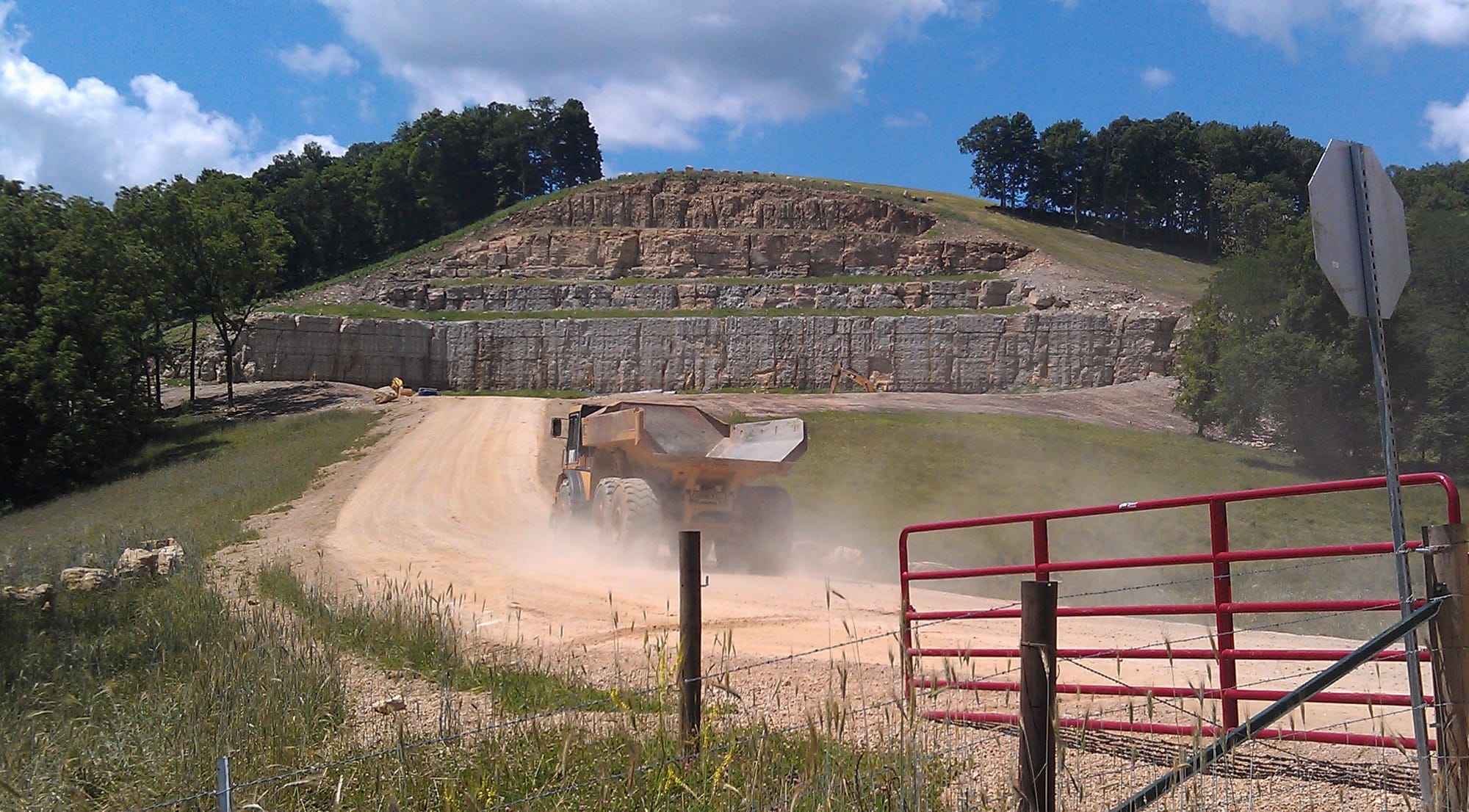 A truck enters a rural spot near Clayton, Iowa, on June 24, 2014, where Pattison Sand Company was preparing to open a new mine in the side of a hill. Pattison, which produces industrial sand for the natural gas and oil industries, has about 35 acres of underground mine and 300 acres of above ground for plant operations, shipping and storage, ponding and drying, maintenance, a fabrication shop, reclamation areas and an open pit mine