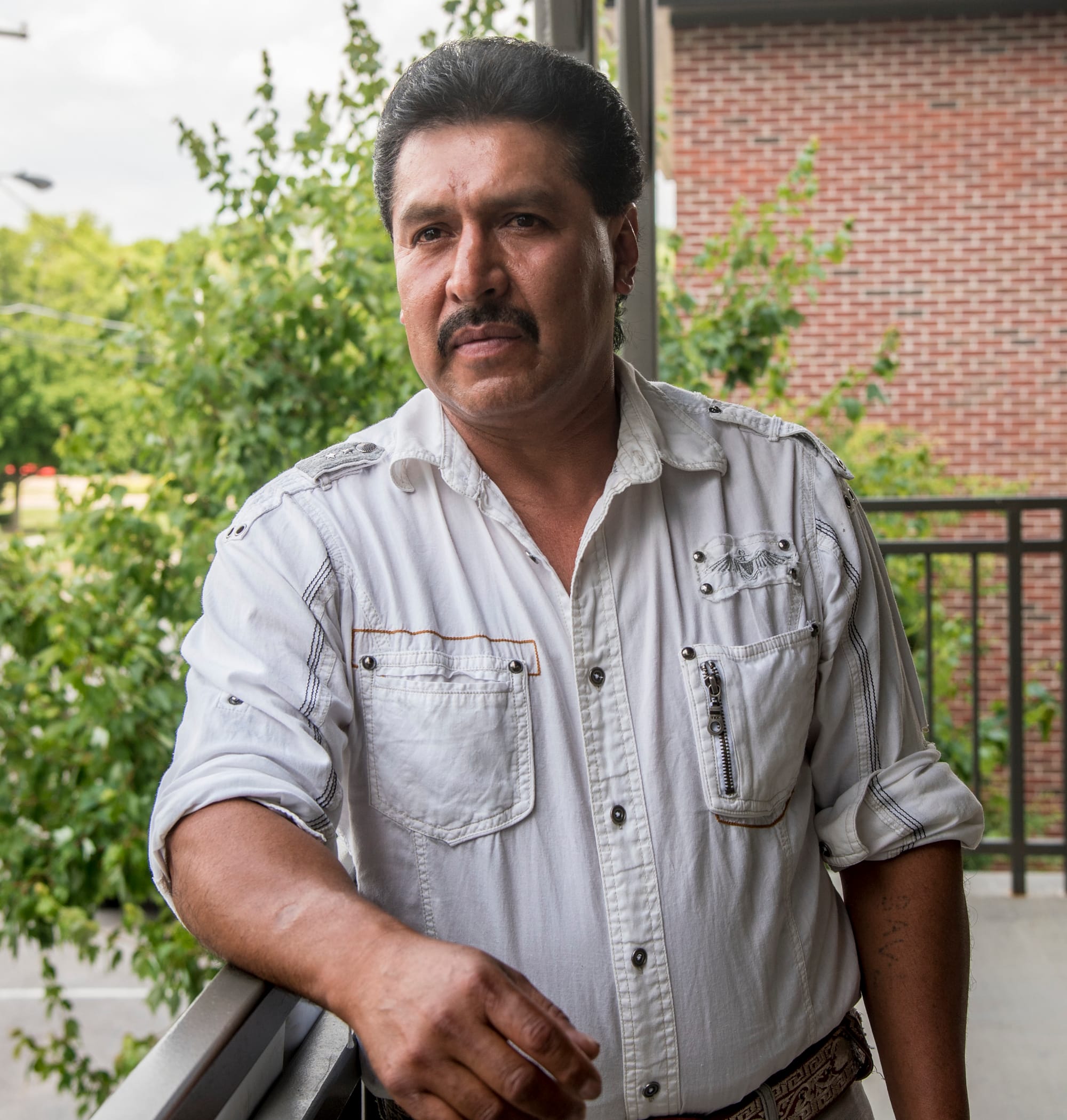 Baltazar Arvisu, 50, talks about his experiences working as a migrant farmworker throughout the United States on June 12, 2016. Arvisu has worked throughout the country picking fruits and vegetables. He says he now tries to find his own housing during jobs.