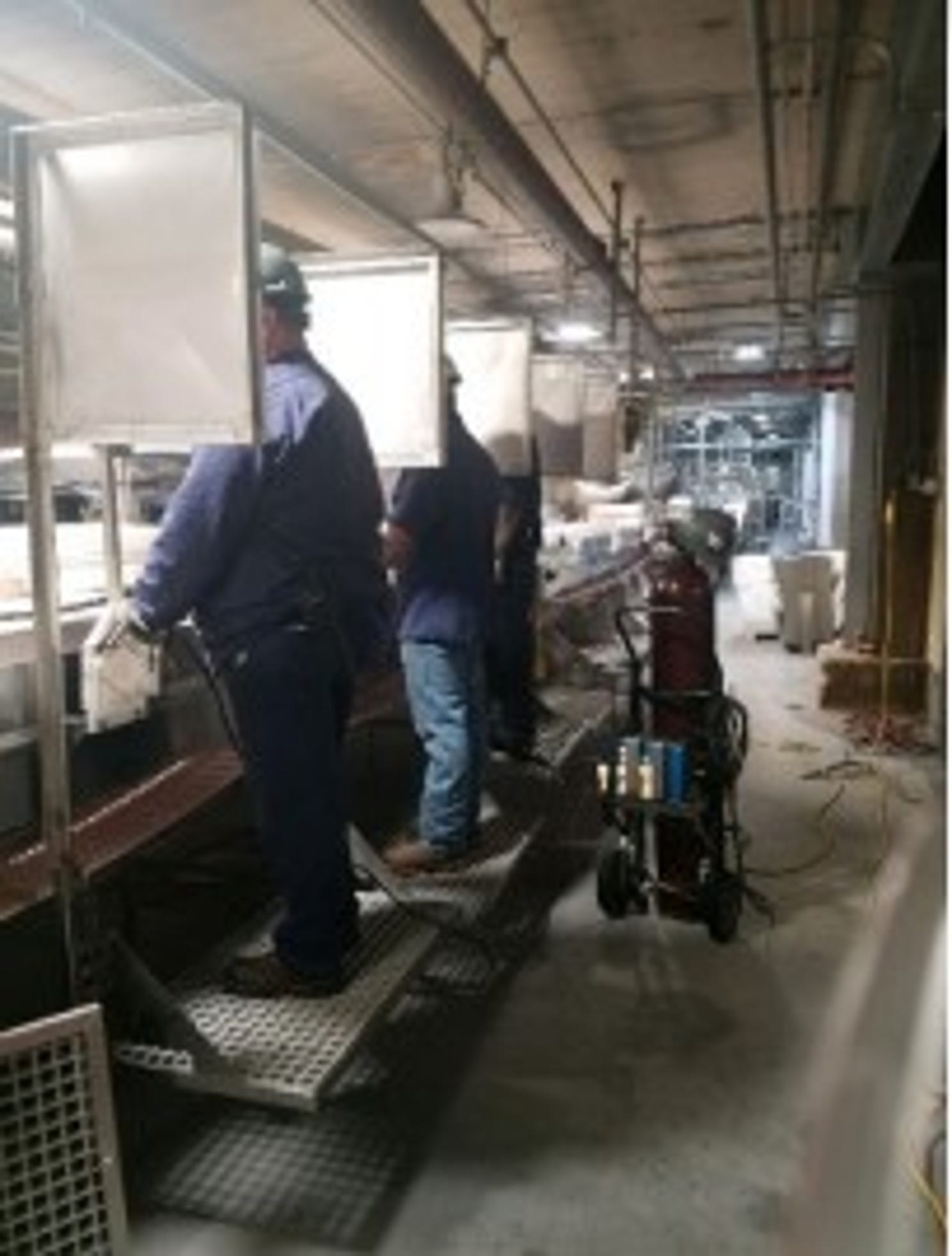 A JBS beef plant in Greeley, Colorado installed barriers to enforce worker spacing after a COVID-19 outbreak shuttered the plant. This photo appeared in a reopening plan the company sent to local health officials.