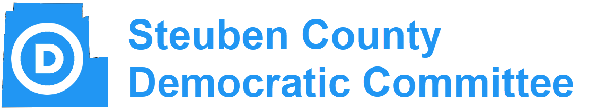 The logo of Steuben County Democratic Committee. On the left is a blue outline of Steuben County superimposed with the Circle D logo of the Democratic party. On the right are the words, Steuben County Democratic Committee, in blue text.