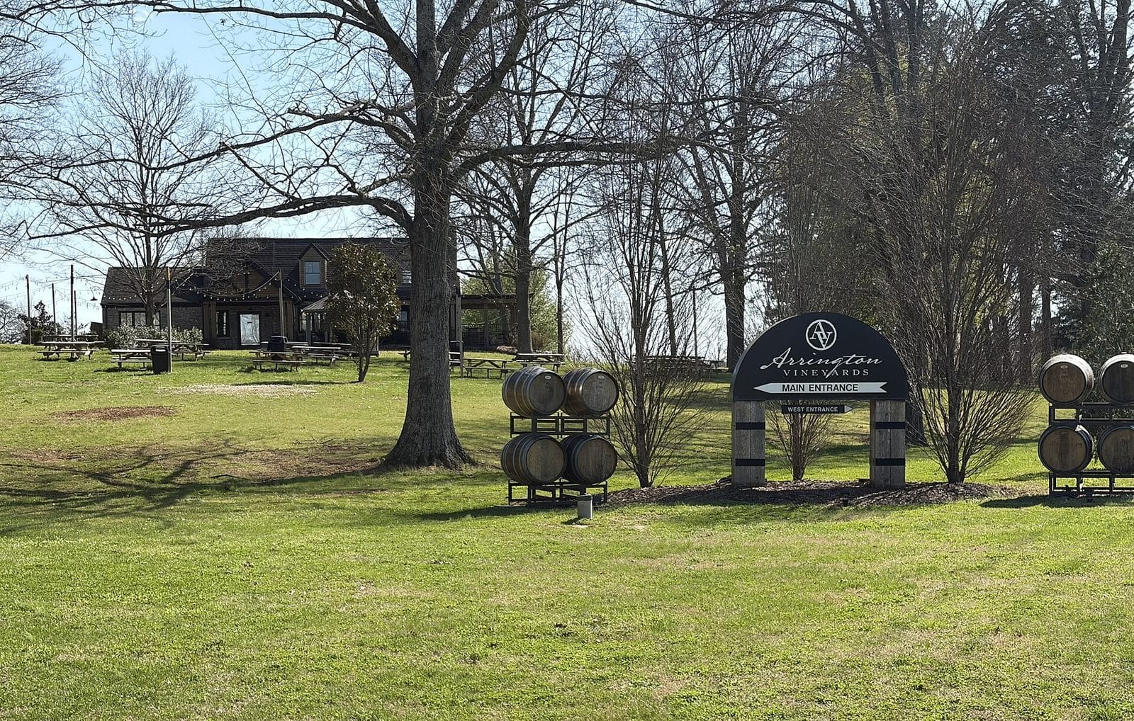 Arrington Vineyards sign and lawn under bare trees