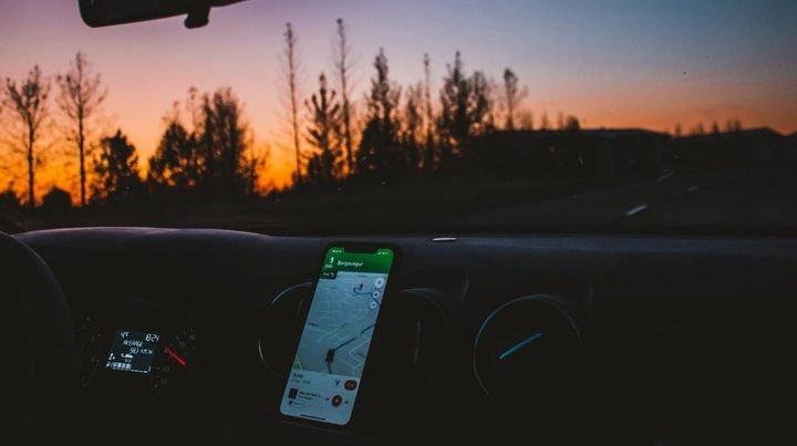 Phone with GPS resting on the dashboard