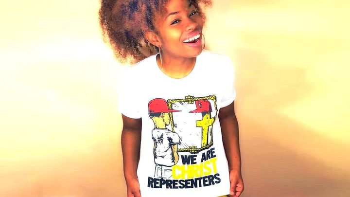 Shirt of man looking into the mirror at the cross.