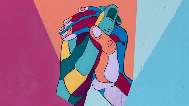 Grateful hands in a colored drawing.