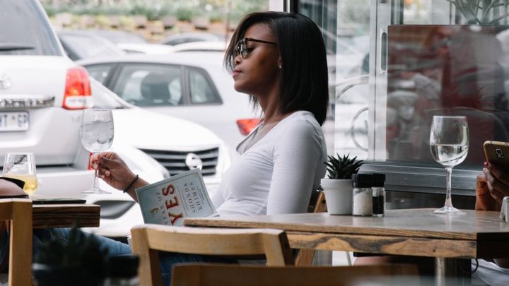 Picture of woman at the table by herself.