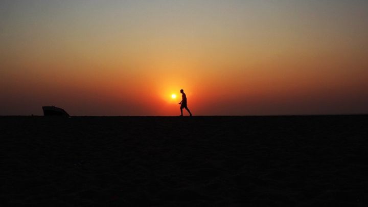 Man pacing through the desert.