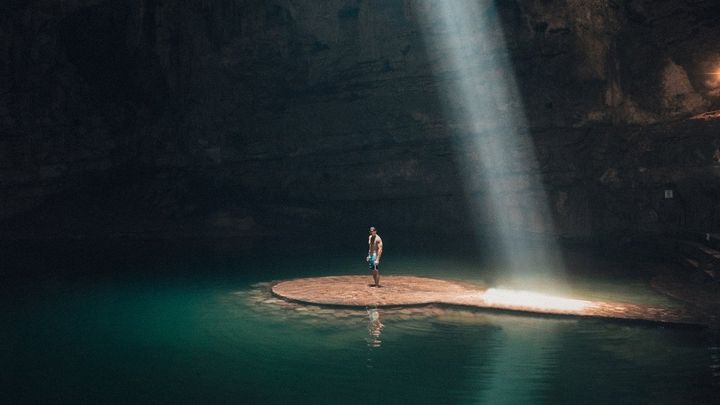 Man standing on an isle by himself.