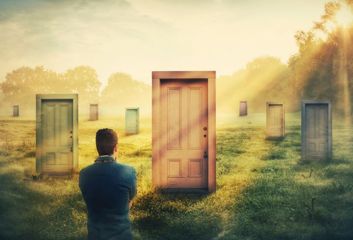 Man choosing between doors and paths under the Sun