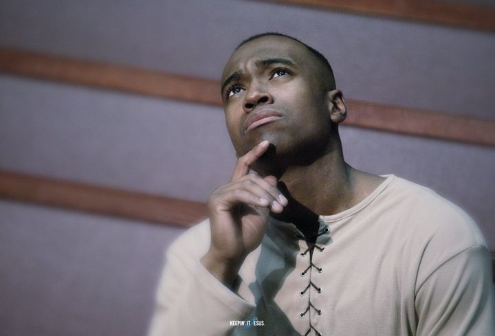 Man staring up in church