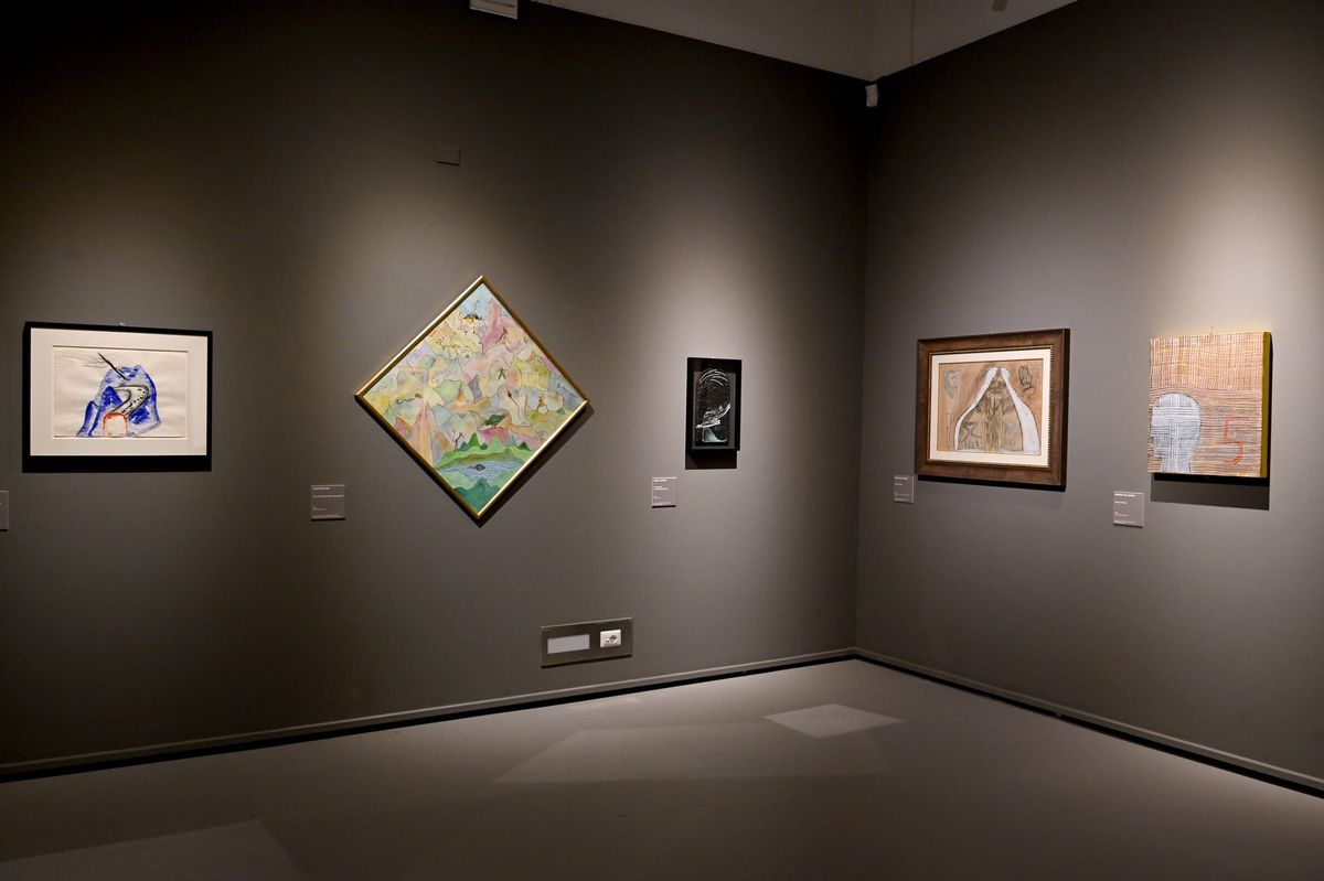 A view of an exhibition room at Palazzo Reale, Milan, featuring masterpieces by Dalí, Warhol, and other artists.