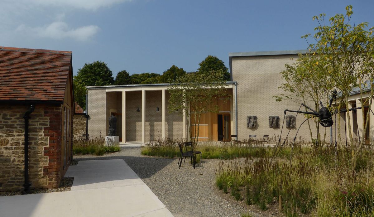 Hauser & Wirth Somerset Cloister with modern design by Laplace and Co, lush planting by Piet Oudolf, and Louise Bourgeois’s large spider sculpture