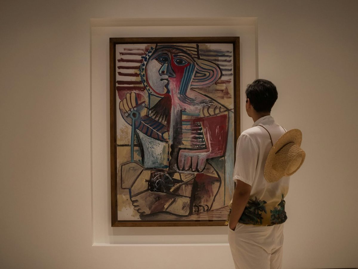 Picasso’s Boy with a Shovel painting exhibited at the Museo Picasso Málaga, the genuine artwork contrasting with forged Picassos